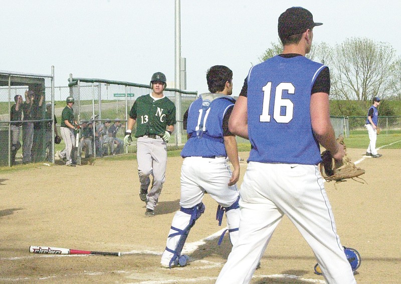 Ryan Boland/FULTON SUN photo: North Callaway junior shortstop Zach Lavy scores on senior center fielder Grant Cundiff's two-run single in the bottom of the first inning in the Thunderbirds' 11-7 MMC victory over South Callaway on Friday night at Auxvasse. Unbeaten and state-ranked North Callaway secured its first-ever conference championship.