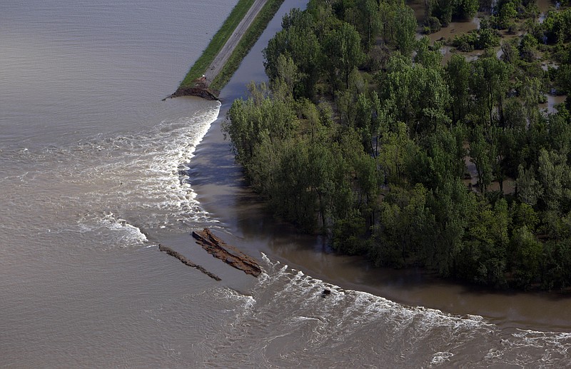Water flows through an intentional breech in the Birds Point levee Tuesday in Mississippi County, Mo. The Army Corps of Engineers blew a two-mile hole Monday night into the levee to relieve pressure on Cairo, Ill., from rising floodwaters. 