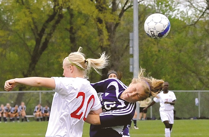 
Corrine Mullarkey of the Jefferson City and Jenna Poire of Helias collide as they go for the ball during a game last month at the 179 Soccer Park. The two teams will meet again tonight.