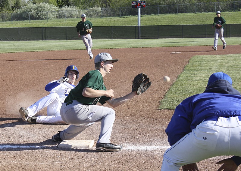 Ryan Boland/FULTON SUN photo: North Callaway sophomore third baseman Jacob Kee waits for the throw from senior catcher Zak Kee as Fatima sophomore pitcher Patrick Schnieders steals third in the second inning of Tuesday's semifinal.