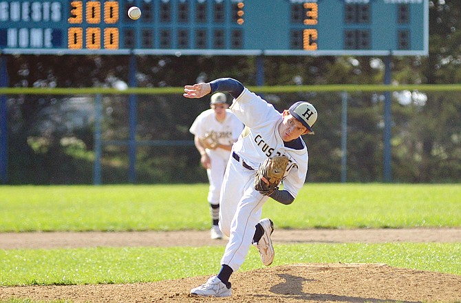 Blake Monson of Helias delivers a pitch during Wednesday's game against Pacific at the American Legion Post 5 Sports Complex.