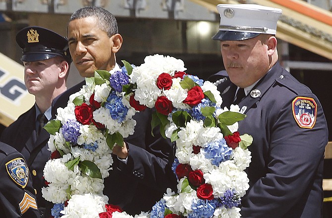 President Barack Obama prepares to lay a wreath at the National Sept. 11 Memorial at ground zero in New York.