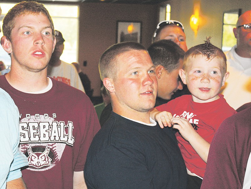From left, William Woods junior pitcher Kyle Burns, freshman catcher Derek Fletcher and his younger brother, Jayden, look on during Sunday night's watch party at Arris' Pizza in Fulton as the Owls learned their destination for the NAIA national tournament. No. 4 seed William Woods faces No. 5 Huntington (Ind.) University at 11 this morning in the first round of the Montgomery, Ala., bracket.