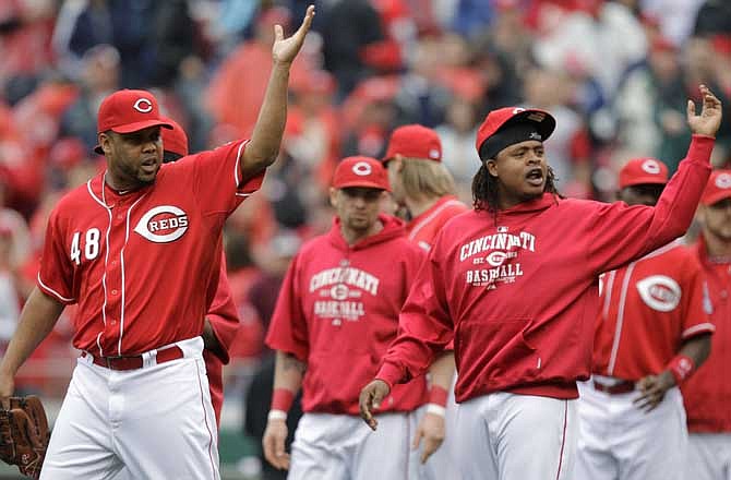 Cincinnati Reds closer Francisco Cordero (48) and pitcher Edinson Volquez, right, gesture towards the St. Louis Cardinals dugout as they exchanged words following the Reds' 9-7 win in a baseball game, Sunday, May 15, 2011 in Cincinnati. Cincinnati swept the three-game series.