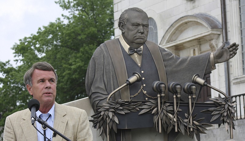 St. Louis sculptor Don Wiegand speaks to about 250 Missourians gathered Friday for the dedication of his sculpture near the entrance to the National Churchill Museum in Fulton. The bas relief depicts the exact moment in Churchill's "Sinews of Peace" address in Westminster College in Fulton 65 years ago on March 5, 1946, when Churchill raised his arm and lowered it as he uttered the phrase "an iron curtain has descended across the Continent."