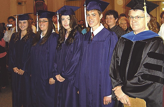 Lighthouse Preparatory Academy held its fourth graduation ceremony on Sunday in Jefferson City, with three graduating seniors: from left, Molly Archer, Kalee Hall and, second from left, Trenton Wieling. Also shown are Rebekah Hough, third from left, who attended LPA but isn't getting her diploma from there, and, at right, Greg Alexander, the commencement speaker and a teacher at LPA. 