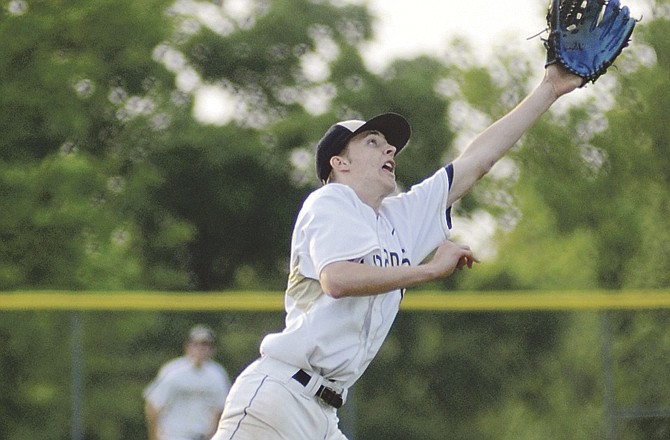 Deion Hughes, shown fielding a comebacker during a recent game against Waynesville, could get the start for Helias in its district opener this afternoon.