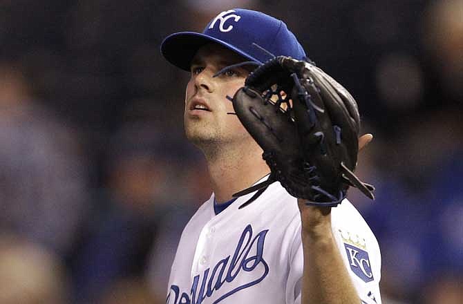 Kansas City Royals starting pitcher Vin Mazzaro (32) catches a ball from an infielder during the fourth inning of a Major League Baseball game against the Cleveland Indians in Kansas City, Mo., Monday, May 16, 2011. The Indians defeated the Royals 19-1. Mazzaro made the record book as pitching the worst game in Royals history. 