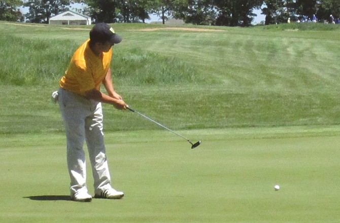 Helias' Michael Huber hits a putt during Tuesday's final round of the Class 3 State Golf Championship at Silo Ridge Golf Course in Bolivar.