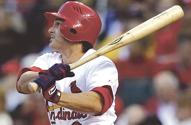 St. Louis Cardinals' Ryan Theriot hits an RBI-single during the fourth inning of a baseball game against the Philadelphia Phillies Monday, May 16, 2011, in St. Louis. 