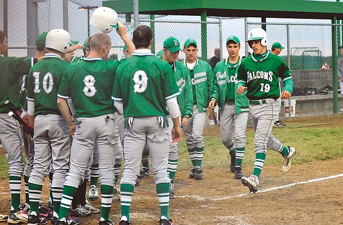 Daniel Castillo (19) of Blair Oaks is greeted by his teammates after hitting a two-run home run in the the top of the seventh inning during Wednesday's game against St. Francis Borgia in Wardsville.