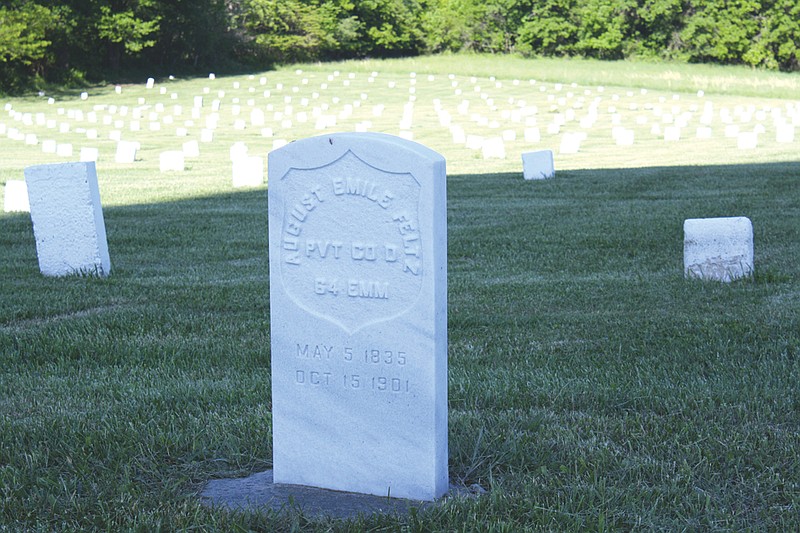 Many nameless white tombstones at the Fulton State Hospital Cemetery surround the new headstone of August Emile Feltz, a Civil War veteran who died at FSH of tuberculosis in 1901.