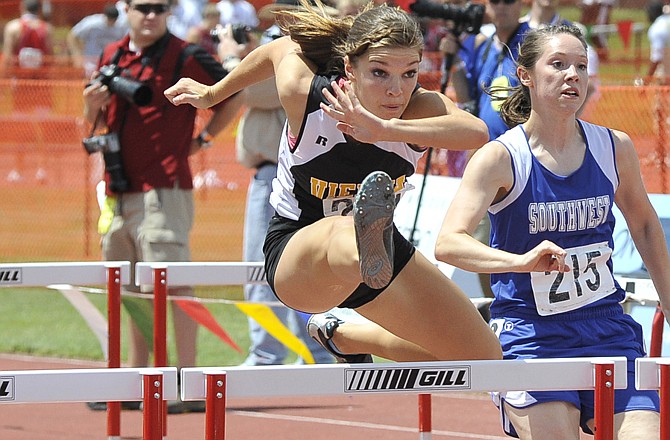 Katlyn Meier of Vienna competes in the Class 1 girls 100-meter hurdles Saturday at Dwight T. Reed Stadium. Meier won the state title in the event. 