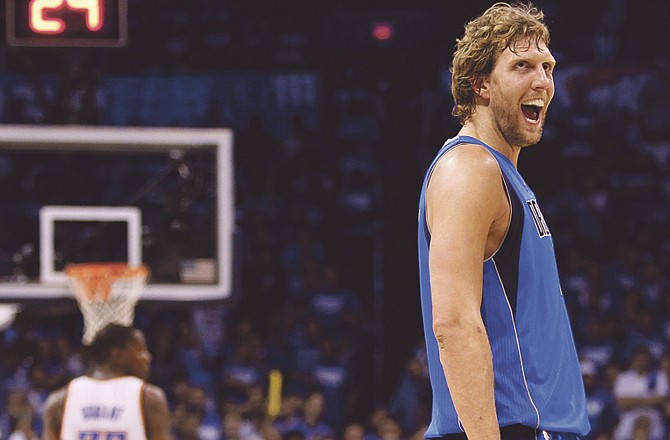 Dirk Nowitzki of the Mavericks smiles during the second half of Saturday night's game against the Thunder in Oklahoma City. 
