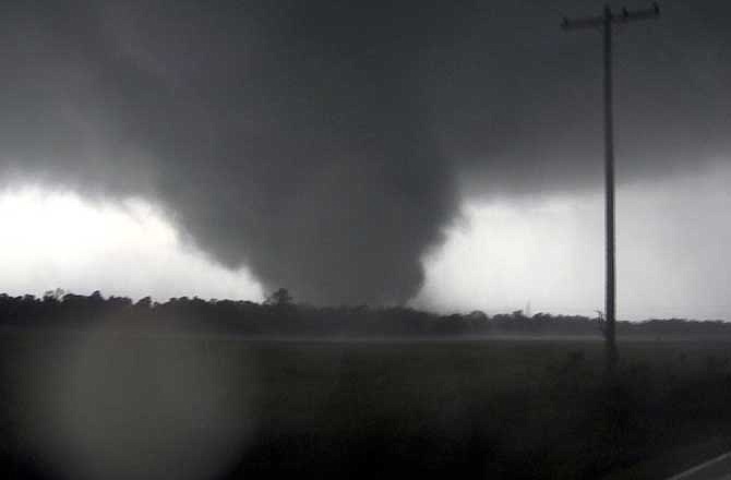 This frame grab from video shows a massive tornado on Sunday, May 22, 2011, outside Joplin, Mo. The tornado tore a 6-mile path across southwestern Missouri killing at least 116 people as it slammed into the city of Joplin, ripping into a hospital, crushing cars like soda cans and leaving a forest of splintered tree trunks behind where entire neighborhoods once stood. 