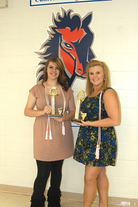 At the CHS Music Banquet, Jessica McKenzie, left, and Pax Baker, are awarded the National School Choral Award. 