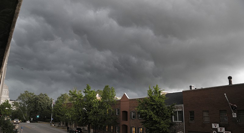 Afternoon storm clouds were an ominous sight before a downpour ensued Wednesday afternoon. Tornado warnings and dark skies made local residents nervous, but little damaged was reported after the storm passed.