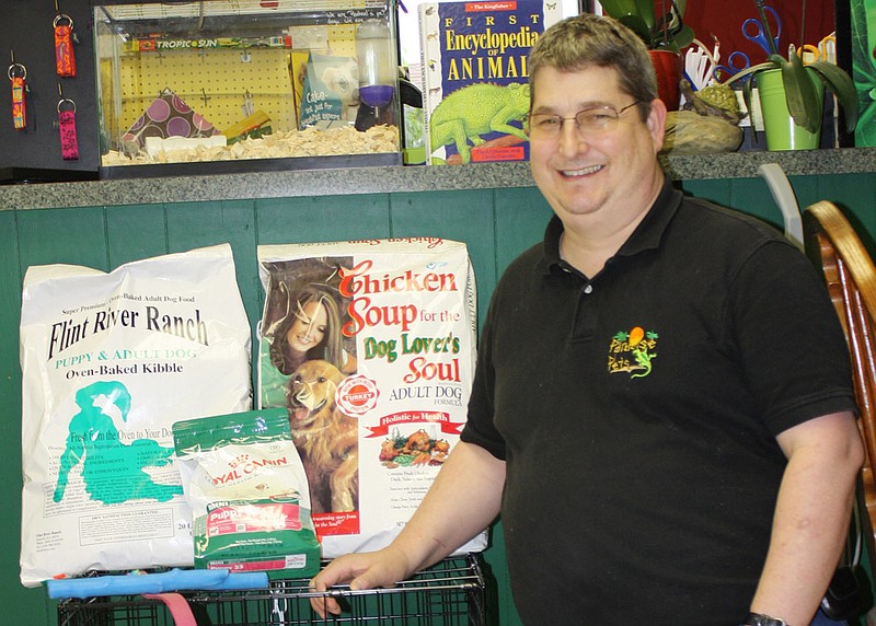 Tom McDowell, owner of Paradise Pets at 901 S. Business 54 in Fulton, with some of the donated pet food and supplies to be sent by the Callaway County Humane Society to aid distressed pets displaced by the deadly tornano that hit Joplin on Sunday.