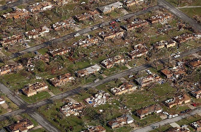 This May 24, 2011 aerial file photograph shows a neighborhood destroyed by the powerful tornado that hit Joplin, Mo.