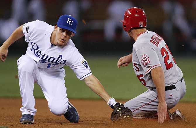 Los Angeles Angels' Peter Bourjos (25) slides safely into second past the tag of Kansas City Royals second baseman Chris Getz for a steal in the sixth inning during a baseball game Tuesday, May 31, 2011, in Kansas City, Mo.