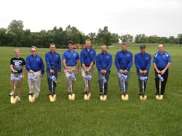 Newly elected members of the Cole County R-I School Board for the 2011-2012 School Year help break ground on the new track and parking lot to be built over the course of approximately 120 days to be completed by late fall Tuesday, May 31; from left, is 2010 Russellville Grad and Lady Indian State Track Champion Sarah Koestner, Randy Koestner (secretary), William Kautsch (vice president/treasurer), Doug Morrow (member), Kris Kirchner (president), Jim Campbell (member), Mike Bungart (member), Mark Thompson (member) and Cole County R-I School District Superintendent Jerry Hobbs.