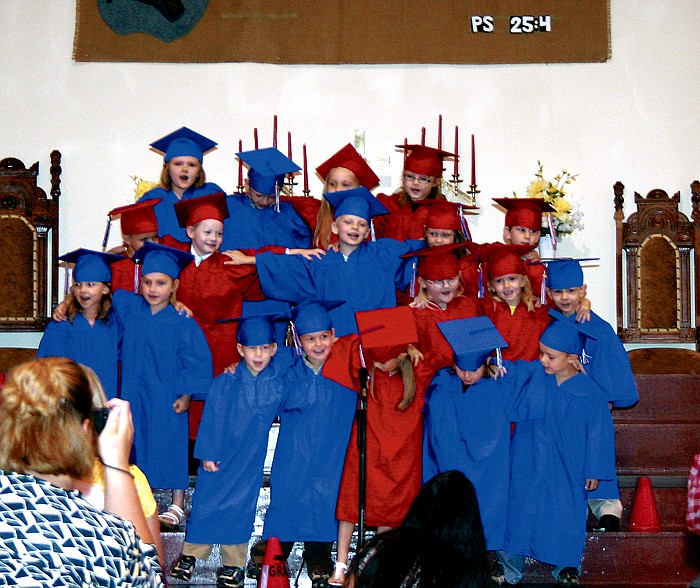 Four-year-old children who attend the United Church of Christ Playschool perform songs at the Class of 2011 Graduation ceremony Thursday morning.