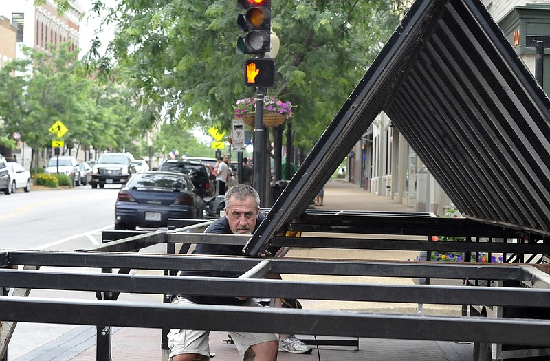 Dan Ranabagar aligns the girders on the main stage Wednesday evening for the first Thursday Night Live show downtown tonight at Madison and High streets.