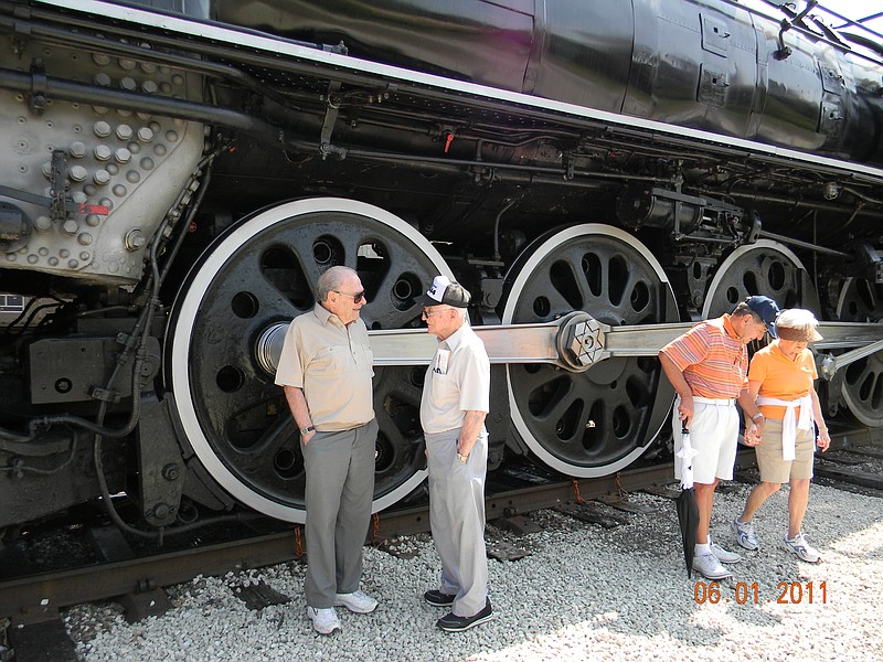 Jack Gaines, right, talks with a visitor to Union Pacific Railroad's No. 844 steam engine Wednesday while the train was on display in Jefferson City. Gaines, who will be 91 in October, used to serve as an engineer on the train.
