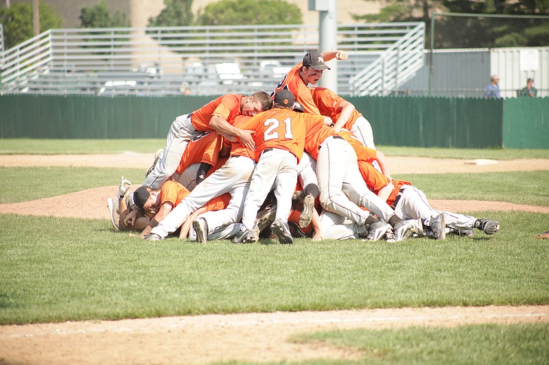 The New Bloomfield Wildcats form a human pile near the mound after demolishing Summit Christian Academy 20-4 in the Class 2 state championship Thursday afternoon at Meador Park in Springfield. The convincing victory gave New Bloomfield its first-ever Class 2 title and its seventh state championship overall, the most in Missouri history.