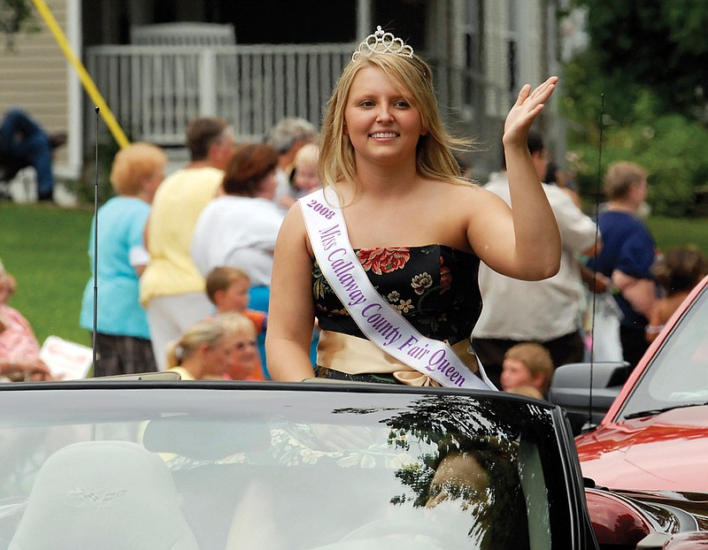 Taylor Bryant, Miss Callaway County Fair Queen, waves during the Grand Parade at the Fulton Street Fair. Bryant held the crown for Miss in 2008 and 2010. This year she will pass it on to the new queen chosen at the street fair.