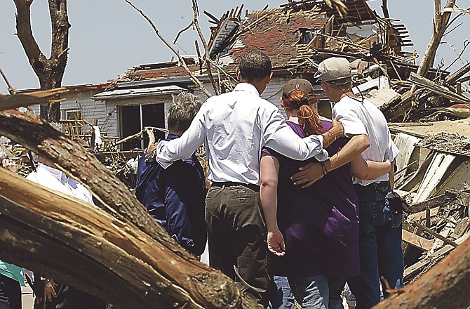 President Barack Obama second from left with residents viewing damage from the tornado that devastated Joplin. 