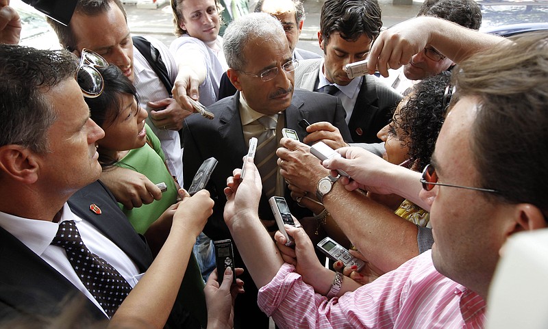 Minister of Energy Mohamed bin Dhaen Al Hamli from the United Arab Emirates is surrounded by journalists as he arrives a hotel for a meeting Tuesday of the Organization of the Petroleum Exporting countries, OPEC, in Vienna, Austria. OPEC decided Wednesday to leave production levels unchanged.