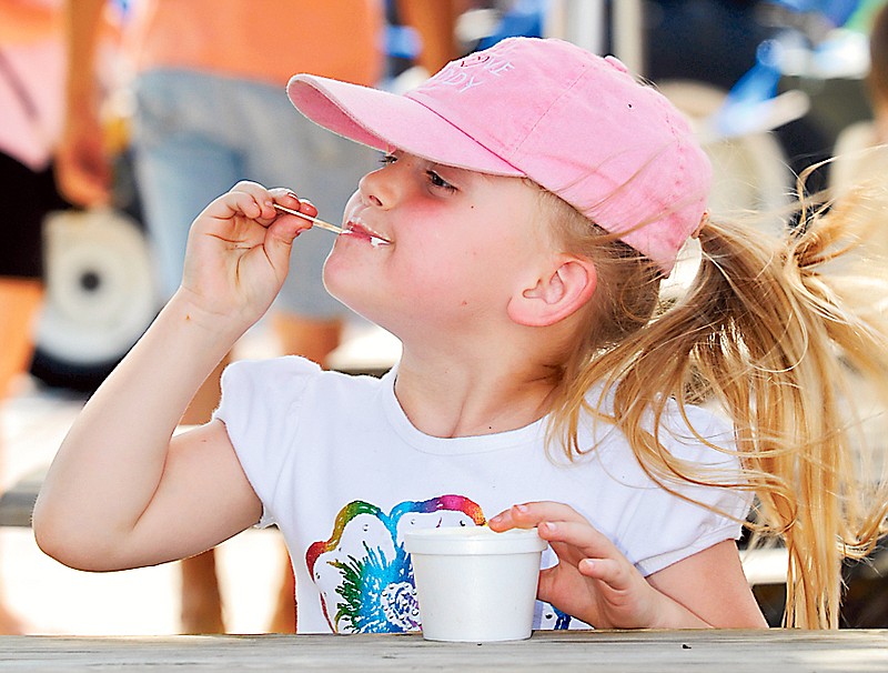 A young fair-goer eats some ice cream at a previous year's Fulton Street Fair. A variety of food booths are on tap for this year's fair June 17-18.