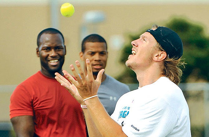 Blaine Gabbert, the Jaguars first round pick in the NFL draft, catches a tennis ball thrown by quarterback David Garrard during an workout Wednesday in Jacksonville, Fla.