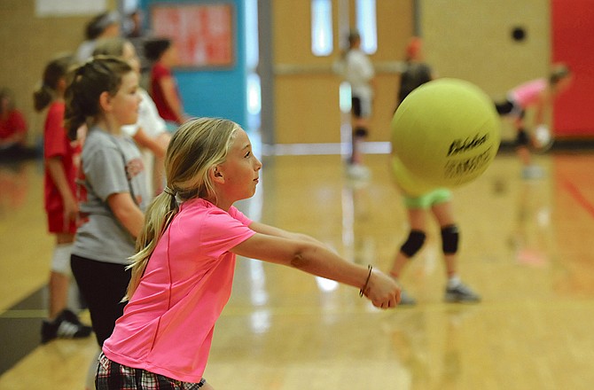 Jacie Buschjost bumps the ball during a drill Thursday in the Jefferson City Lady Jays volleyball camp at Fleming Fieldhouse.