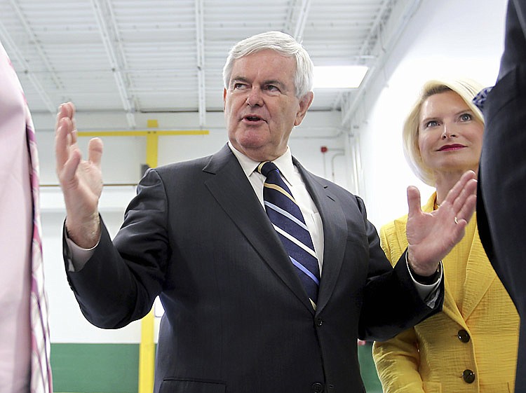 In this June 8, 2011 file photo, Republican presidential hopeful, former House Speaker Newt Gingrich, accompanied by his wife Callista Gingrich, speaks in Hudson, N.H. Gingrich's campaign manager and numerous other key aides have resigned together, a strong blow to his hopes for the Republican presidential nomination.