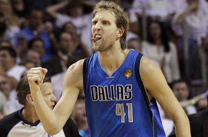 Dallas Mavericks' Dirk Nowitzki reacts in the final minute of the second half of Game 6 of the NBA Finals basketball game against the Miami Heat Sunday, June 12, 2011, in Miami.