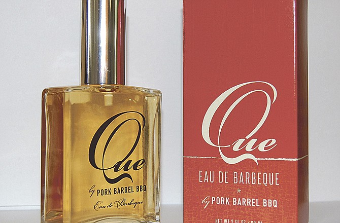 Pork Barrel BBQ has introduced "Que" Eau de Barbeque, a novelty cologne designed to publicize the company's award-winning barbecue sauces and rubs. 