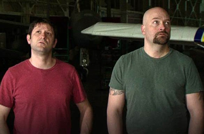 Grant Wilson, left, and Jason Hawes are shown above looking for paranormal activity in a Ghost Hunters episode shot at Pearl Harbor. They spent time last week investigating at the former Missouri State Penitentiary in Jefferson City for an upcoming episode of their Syfy channel series. (Ghost Hunters/SyFy.com photo)