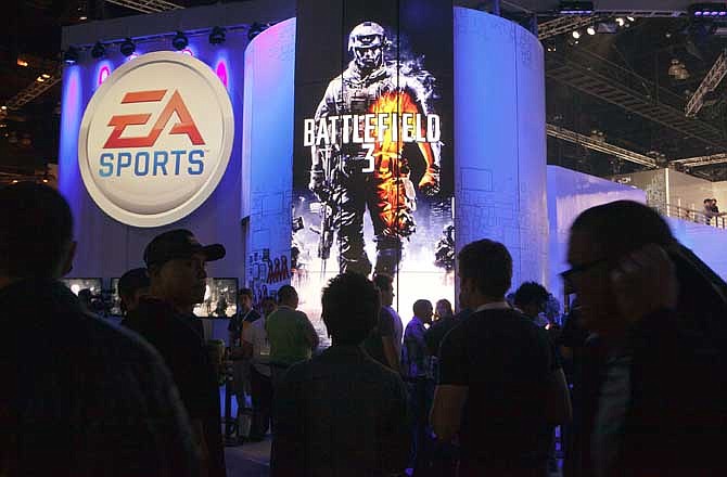 Attendees line up at the Electronic Arts booth to play the new Battlefield 3 video game Wednesday, June 8, 2011 at the 2011 Electronic Entertainment Expo in Los Angeles.