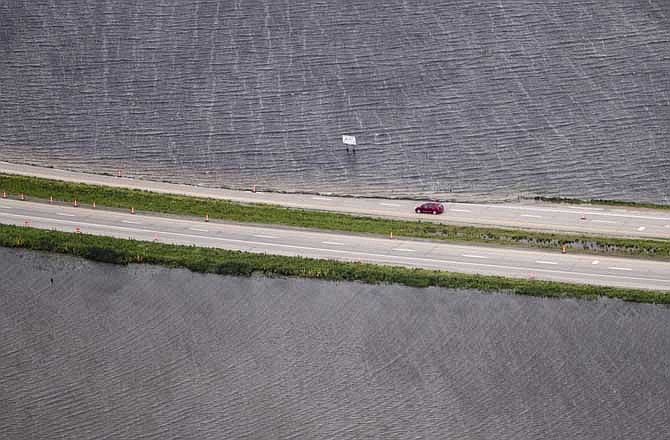 Interstate 29, north of Hamburg, Iowa, is down to one lane southbound due to flooding from the Missouri River, Monday, June 13, 2011. The rising Missouri River has ruptured two levees in northwest Missouri, sending torrents of floodwaters over rural farmland toward the southwest Iowa town of Hamburg and the northwest Missouri resort town of Big Lake. 