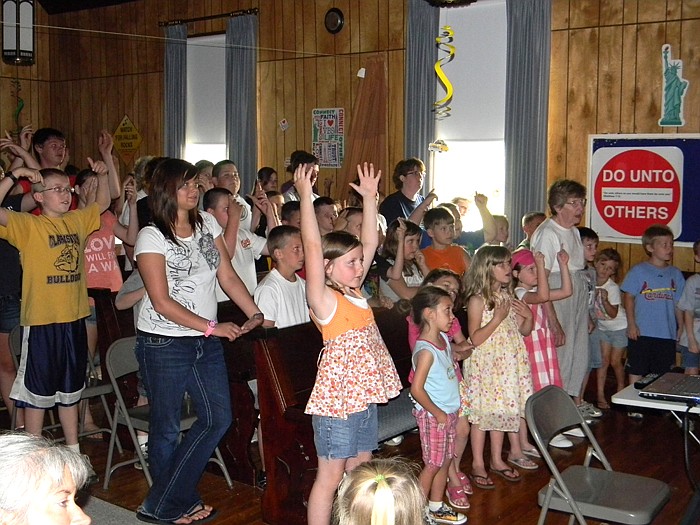 Children sing during the opening ceremony.