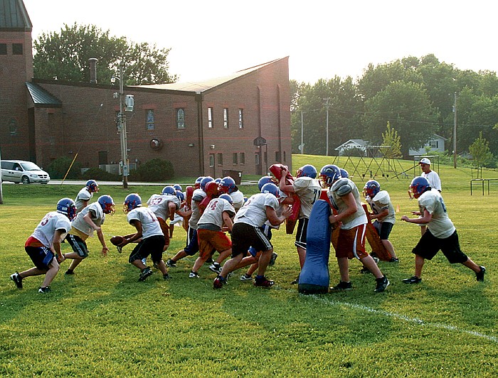 Boys who attended the California High School Football Camp for grades 9-12 last week get a workout June 8, at the California Middle School practice field.