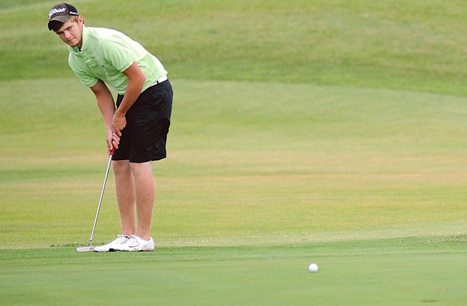 Ryan Rost watches his putt on the ninth hole Tuesday at Eagle Knoll Golf Club during the Junior Match Play Championships. 