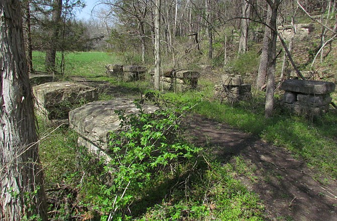 Stone pilings are all that is left of the trestle bridge, which was once part of the C&A Railroad.