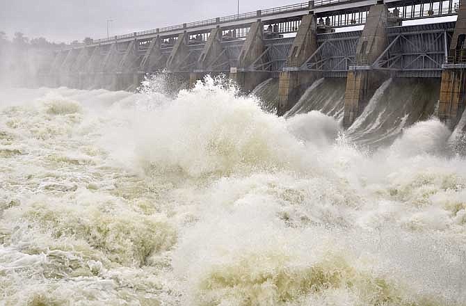 In this June 14, 2011 photo, water roils out of the spillways below the Gavins Point Dam on the Missouri River near Yankton, S.D.