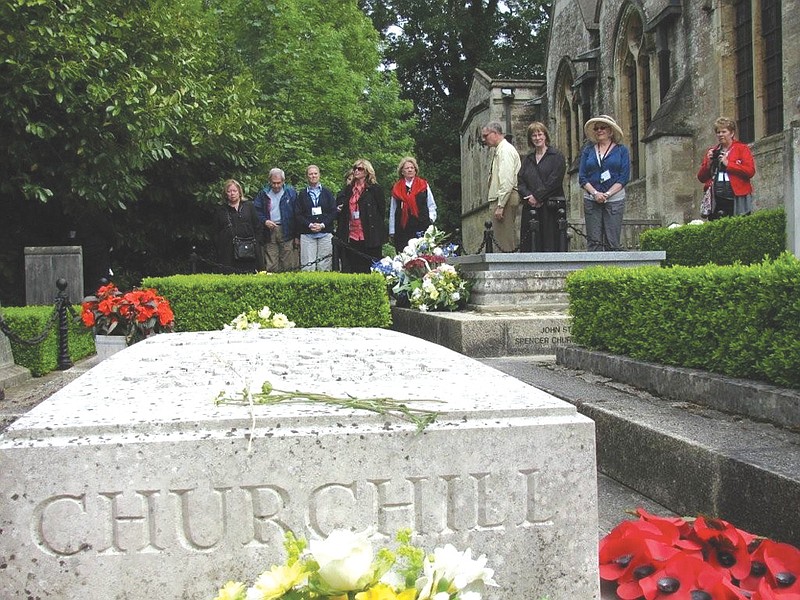 The National Churchill museum's tour group visits the St. Martin's Parish Church Cemetery in Bladon, England, where Winston Churchill and his family are buried.
