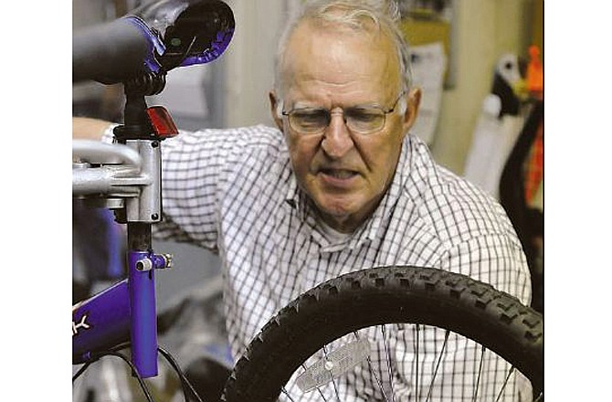 Don Meyer, owner of J&D Bicycle Shop in Jefferson City, works on a bicycle.