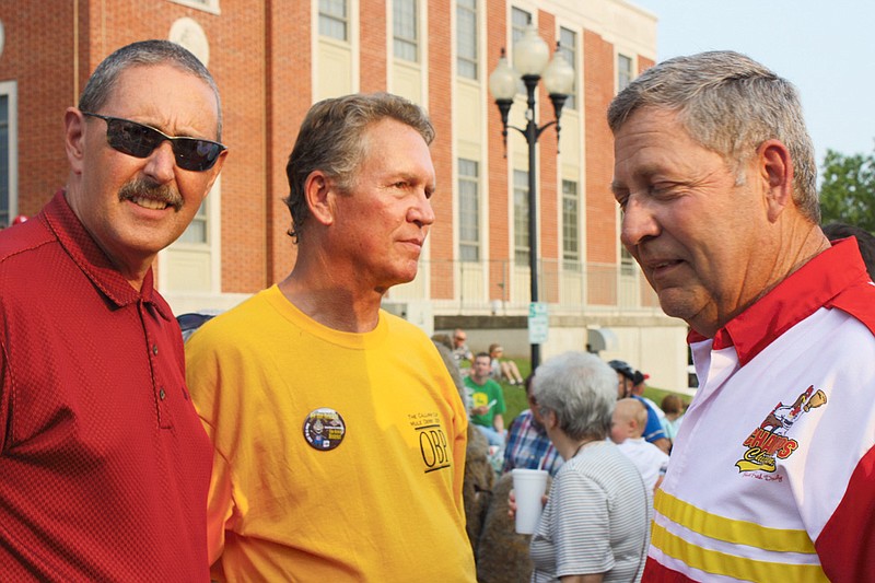 Three friendly competitors in the annual Mule Derby at the Fulton Street Fair are, from left, Bruce Harris of Callaway Bank, John Bell of Ovid Bell Press, and Roger Moser of Moser's Supermarkets. The three had their side race runoff with an entry fee of $1,000 each as a donation to SERVE. The two finishing second and third had to donate an additional $1,000 to SERVE. In the end Harris's mule won but he also donated an extra $1,000 to SERVE, giving SERVE a total contribution of $6,000 from the three Fulton men. The winner of the actual Callaway Cup Mule Derby was Moser's Supermarket.