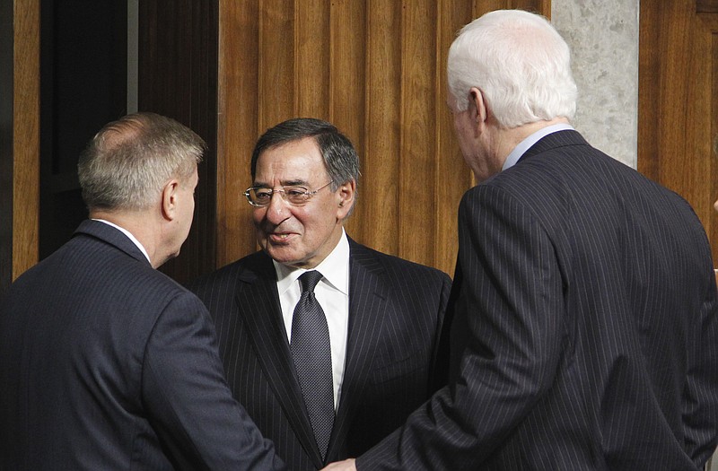 Former CIA Director Leon Panetta (center) is greeted on Capitol Hill on June 9 by Sens. Lindsey Graham and John Cornyn as he arrives to testify before a Senate Armed Service Committee hearing on his nomination. The Senate approved Panetta as defense secretary on Tuesday.